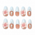 Bluebell Romance handmade press-on nails with pale blue French tips, pink flowers, pearls and crystals