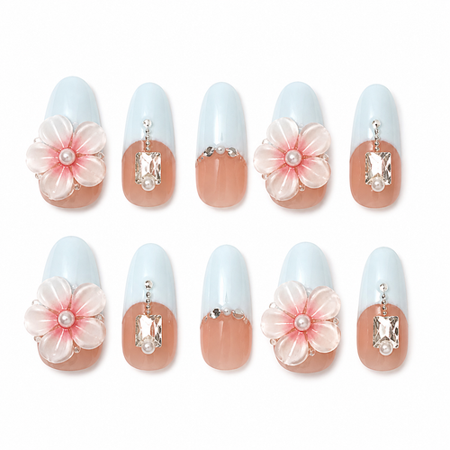 Bluebell Romance handmade press-on nails with pale blue French tips, pink flowers, pearls and crystals