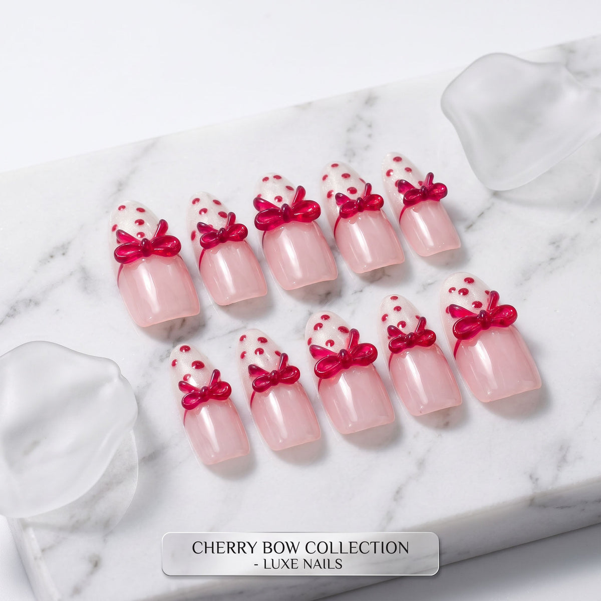 Cherry Bow handmade press-on nails with pale pink colour, white glitter tips and glossy red bows