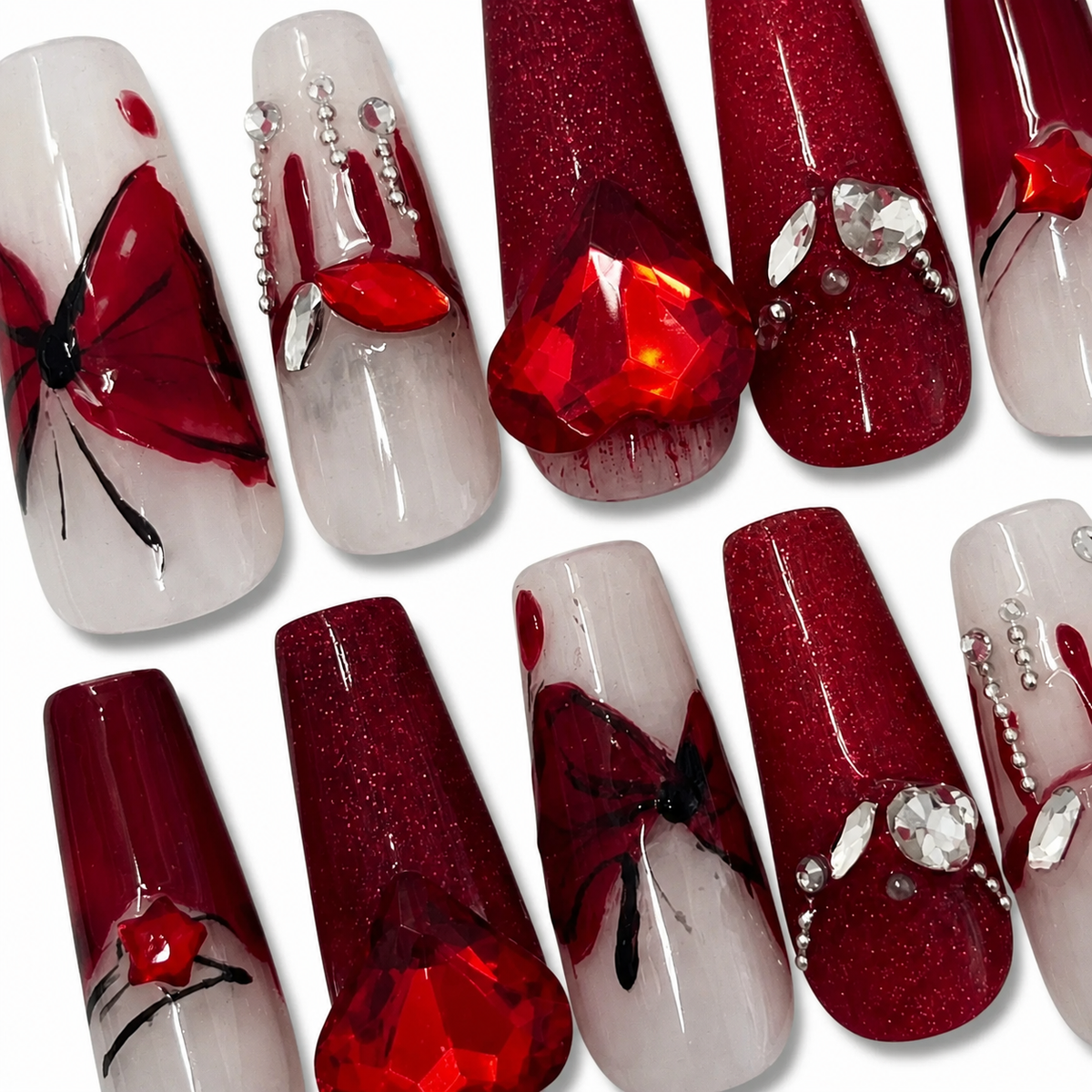 Close-up of Crimson Butterfly handmade press-on nails
